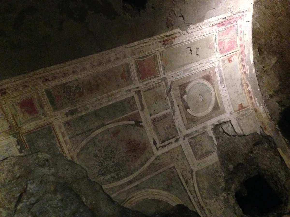 Faded painted grid-panel decoration on a vault of the Domus Aurea