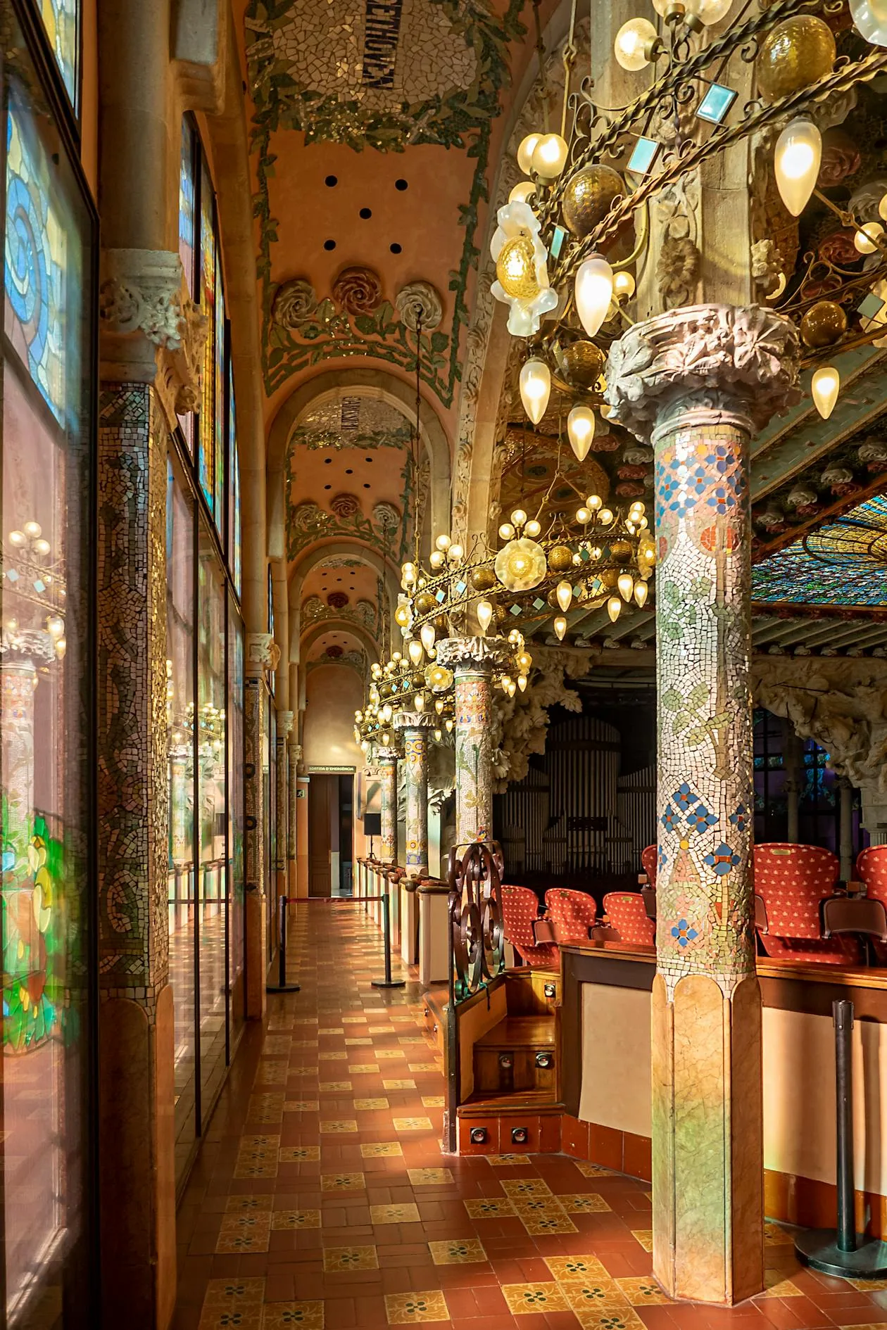 Interior of Palau de la Música Catalana showing the stained glass dome ceiling