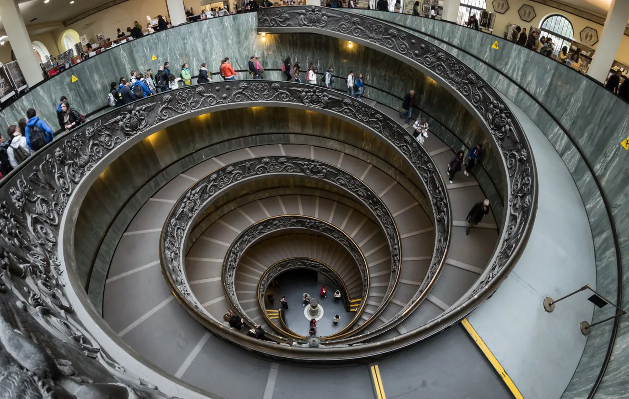 Visitors queuing at a major European museum entrance